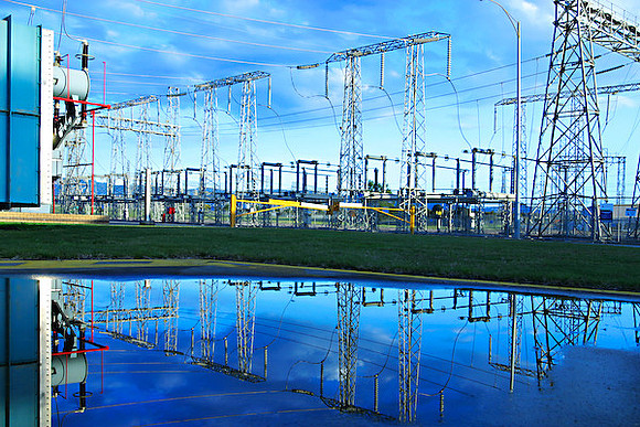 Electricity power generation plant, transmission lines with water reflection